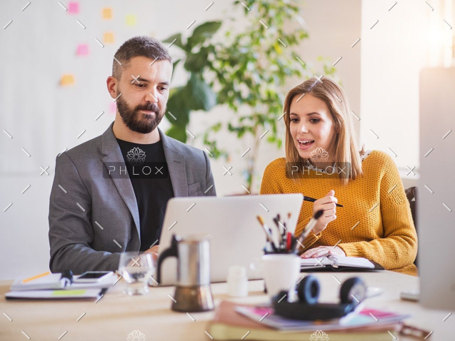 demo-attachment-172-two-business-people-with-wheelchair-in-the-office-P7XLSBC